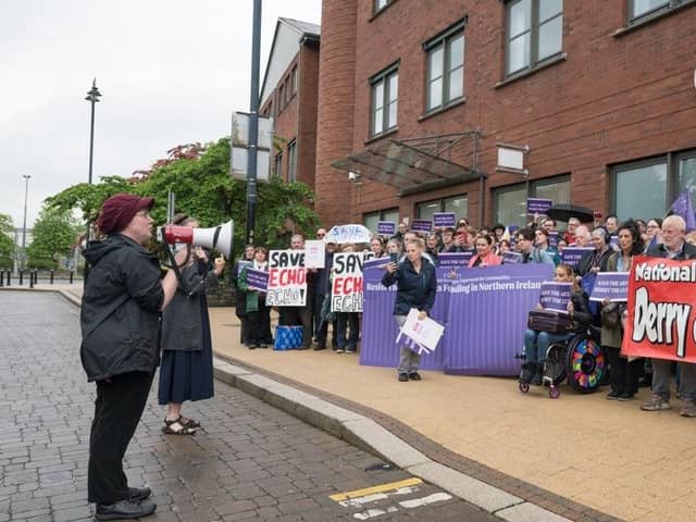 Emma Walker-Farren addressing the rally at the Department for Communities’ offices in Derry. (Credit: Neil Harrison)