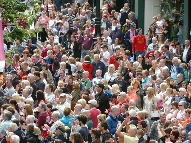 People enjoy the traditional music on Shipquay Street as Derry welcomes thousands of visitors for the Fleadh. (DER3313PG062)