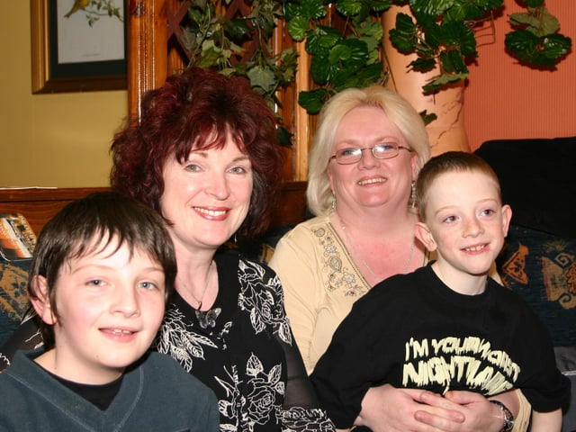 Having a good time at the party are Cormac Marie Breege and Aidan 4756 dd : .