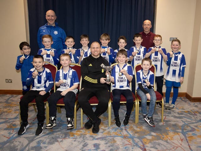 Ronan O'Donnell, Irish Football Association, special guest at the D&D Youth FA Annual Awards at the City Hotel on Friday night presents Culmore Youth FC U9s with the Summer Cup. Included are coaches Uel Watson and Ross Jackson-Forrest.