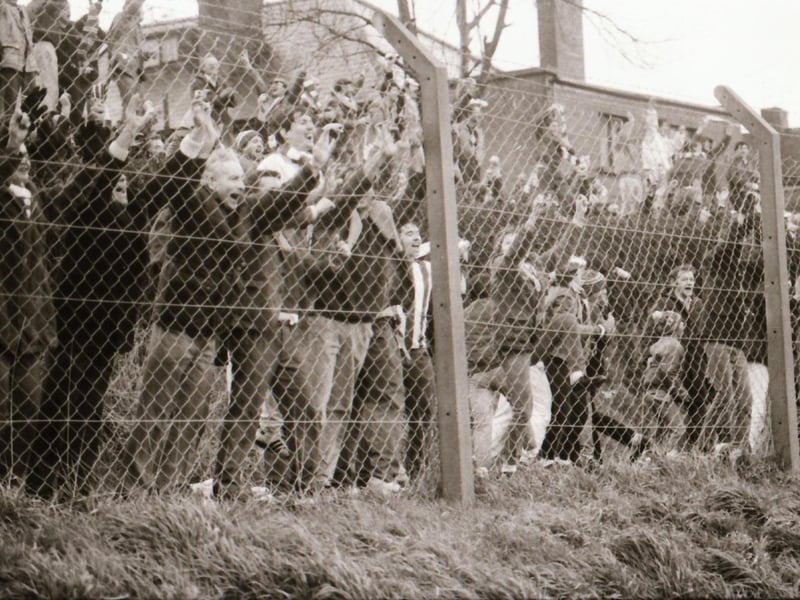 Derry City in action as fans watch on.