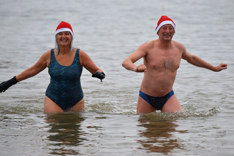 Swimmers brave the elements to take part in the annual Christmas morning charity swim at Ludden beach. Photo: George Sweeney. DER2252GS – 08