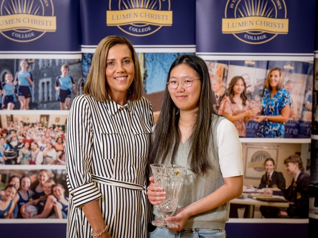 Min Min Chi receives the O'Kelly Award for A2 Biology from Mrs Kathryn Butcher (Head of Biology).