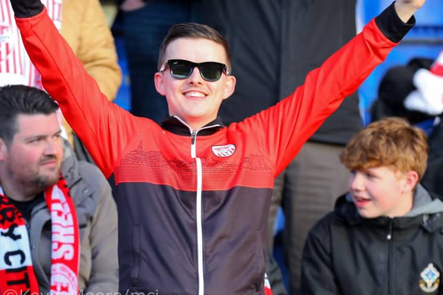 This Derry City fan spots our cameraman at the RSC in Waterford. Mandatory Credit: Kevin Moore/MCI