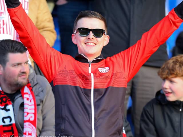 This Derry City fan spots our cameraman at the RSC in Waterford. Mandatory Credit: Kevin Moore/MCI