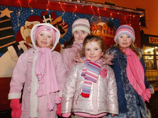 Pictured outside Santa's cabin are, from left, Caragh, Sinead Bronagh, and Aisling McGonigle. (0612PG61) : Christmas in Inishowen in 2005.