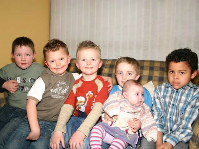Birthday boy Matthew holds baby Charlotte who enjoying the party with friends Tyrone, Eoihan, Adam, Christopher. 2934/dd : Parties and celebrations March 2006: Matthew Wells.