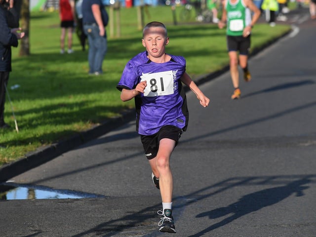 Flynn McCormack, NW Triathlon Club, finshes the inaugural Galliagh Féile 5K road race on Friday evening.  Photo: George Sweeney