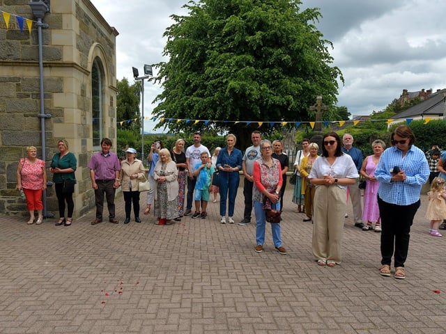 Relatives of children who made their First Holy communion recently attend the Solemnity of Corpus Christi procession in the ground of the church, on Sunday afternoon. Photo: George Sweeney. DER2324GS –