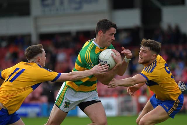 Glenullin ‘s Neil McNicholl battles with Limavady pair Oisin Hassan and Harry McLaughlin during the IFC game in Celtic Park on Sunday afternoon. Photo: George Sweeney