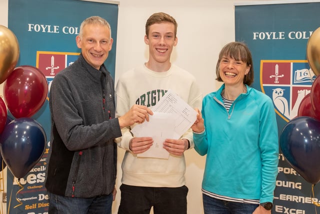 Adam Murray from Foyle College who is celebrating after receiving his GCSE results with his parents Raymond and Sheelagh.
