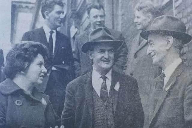 Republican candidate Neil Gillespie (right) with his election agent Mr Gerard O'Doherty and Mrs Nancy Keenan with supporters in the background.