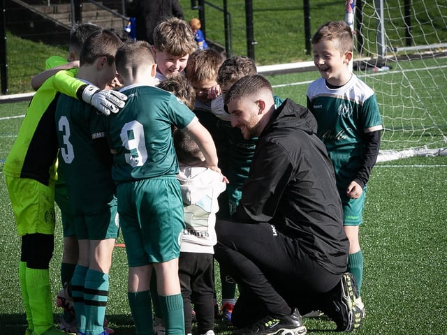 A toddler giving the team talk to the Foyle Harps team on Saturday.