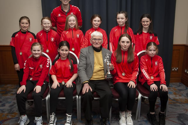John ‘Jobby’ Crossan pictured with the Tristar Girls U11 team, winners of the Winter Cup, during the Annual Awards in the City Hotel on Friday night last. Included is coach Mark Wade.