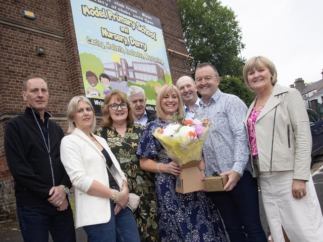 Mrs. Michelle Ramsey, retiring Principal, Model Primary School pictured on Friday with her husband and family.