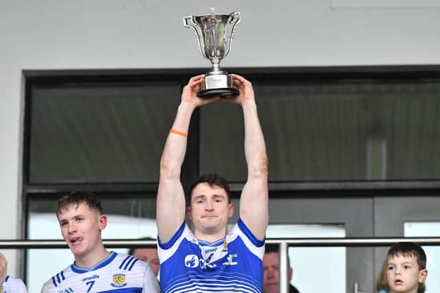 Ballinderry Shamrocks captain Gareth McKinless holds aloft the Derry intermediate Championship trophy in Owenbeg on Saturday. (Photo: Gareth McKinless)