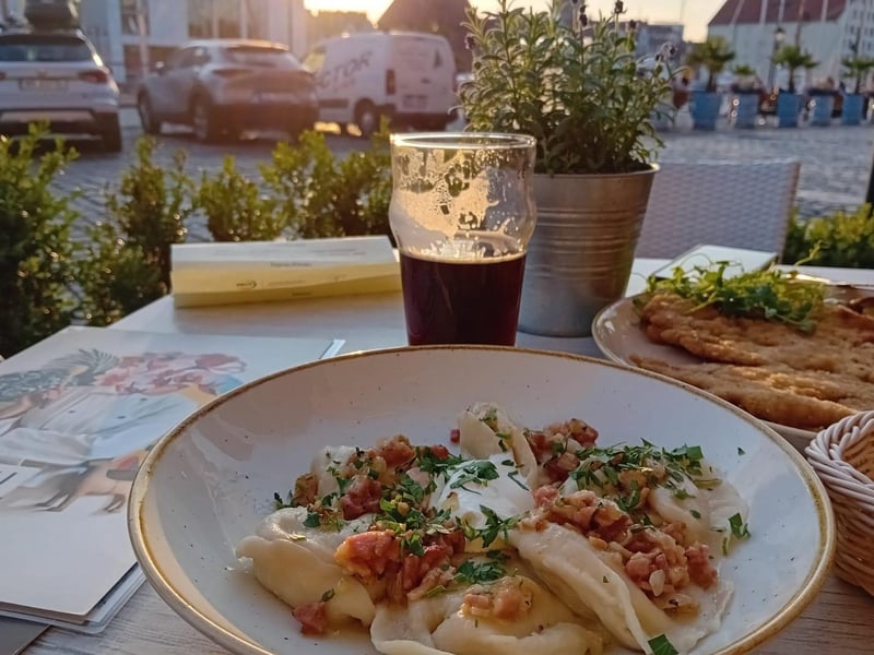 Traditional pierogi - homemade dumplings with curd cheese, potatoes grease and bacon - from Brovarnia Gdánsk.