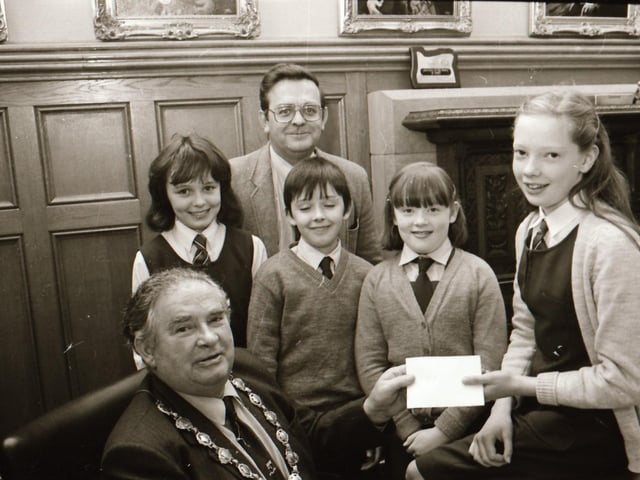 Deanfield children present cheque for Kebele 37 Ethiopia Appeal.