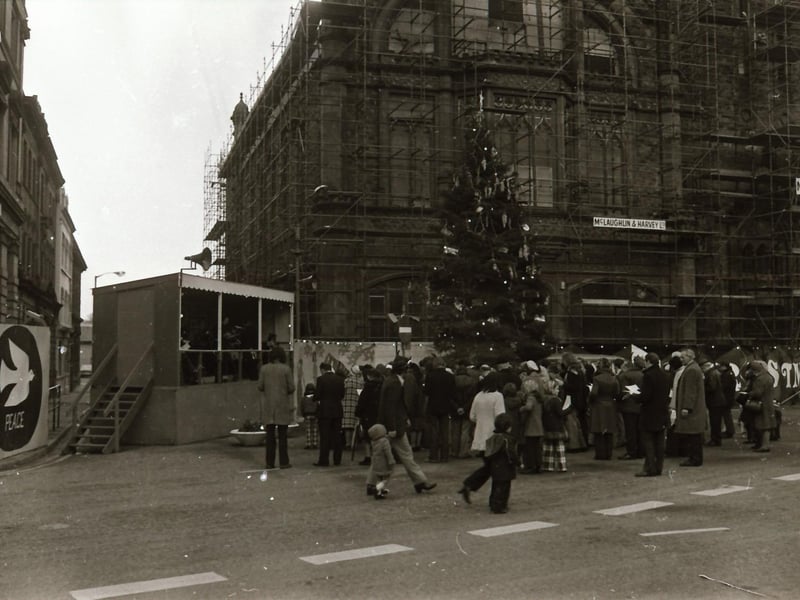 Interdenominational Christmas carols for peace outside the Guildhall in December 1974.