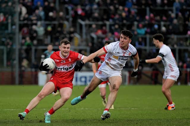 Derry’s Cormac Murphy evades a tackle from Tyrone’s Conall Devlin. Photo: George Sweeney