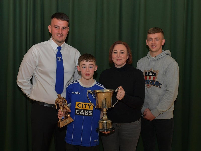 Trojans FC Ronnie Ballard Player of the Year award winner Noah Harkin - McPhillips pictured at the club’s annual prizegiving with Diolain Ward Vice- Chairperson, Alison Ballard and Derry City’s Ciaron Harkin. Photo: George Sweeney