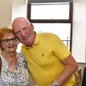 Stephen Butler who recently retired after working 38 years as a postman with his wife Una  at an appreciation celebration held in the Culmore Community Hub.  Photo: George Sweeney