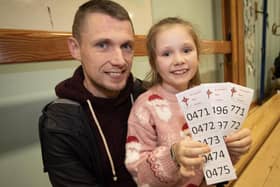 St. Joseph's Boys School teacher Emmett McGinty pictured with his daughter Layla at the school's Wheel of Fortune' on Thursday night.