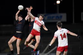 Derry Ruairi Forbes beats Armagh's Michael McSorley to a high ball at the Athletic Grounds on Wednesday night. (Photo: Brendan Monaghan). BM01