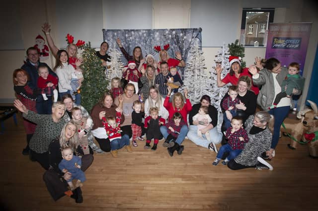 IT’S CHRISTMAS!!!!!. . . . .A section of the parents, children, Gasyard Feile ,and Surestart Edenballymore staff pictured at the ‘Christmas Photos and Rhymetime Christmas Extravaganza at the Bishop Street Community Centre on Friday last. The event was A Streets Alive project funded by Urban Villages and the organisers issued a special thanks to SureStart, Bishop Street Youth Club and The Balloon Room for the success of the event. (Photos: Jim McCafferty Photography)