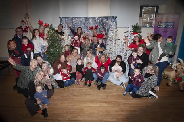 IT’S CHRISTMAS!!!!!. . . . .A section of the parents, children, Gasyard Feile ,and Surestart Edenballymore staff pictured at the ‘Christmas Photos and Rhymetime Christmas Extravaganza at the Bishop Street Community Centre on Friday last. The event was A Streets Alive project funded by Urban Villages and the organisers issued a special thanks to SureStart, Bishop Street Youth Club and The Balloon Room  for the success of the event. (Photos: Jim McCafferty Photography)