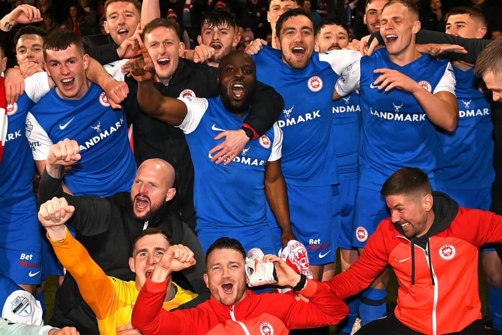 Former Derry City midfielder Joe Thomson celebrates with his Larne teammates after winning their first league title. Photo by INPHO/Stephen Hamilton