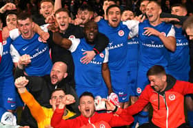 Former Derry City midfielder Joe Thomson celebrates with his Larne teammates after winning their first league title. Photo by INPHO/Stephen Hamilton