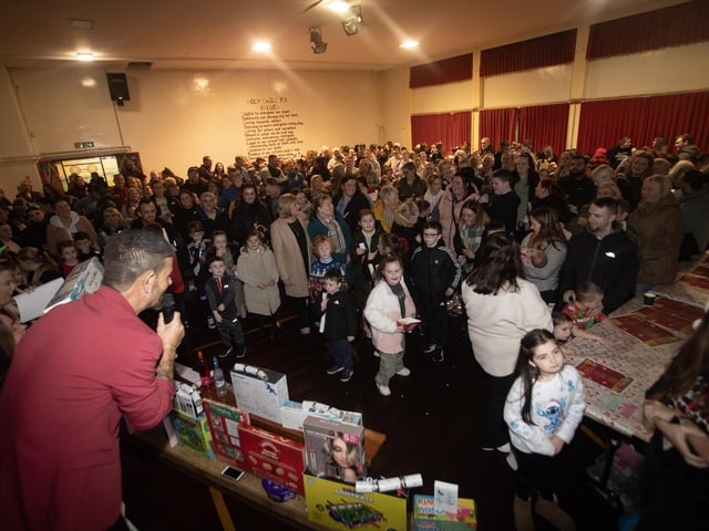 A packed house as Micky Doherty starts Thursday night's rickety wheel at Holy Child PS in Creggan. (Photos: Jim McCafferty Photography)