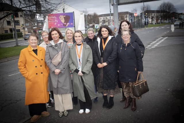 INTERNATIONAL WOMEN'S DAY. . . . .Group pictured at the Dove House Advocacy Project’s ‘International Women’s Day’ banner unveiling at Free Derry Corner on Tuesday. Front from left, Eileen Allen, chair, DHCT, Jayne Quigg, manager, DHCT, Brighdin Deane, Advocacy Project, DHCT, Margaret-Rose McAteer, Advocacy Project, DHCT, and Tina Kelly. Back from left, Paula Devine, Deirdre McDaid, Surestart (Edenballymore), Seanin Gillespie, and Maureen Collins, manager, Hive Support Group. (Photos: Jim McCafferty Photography)
