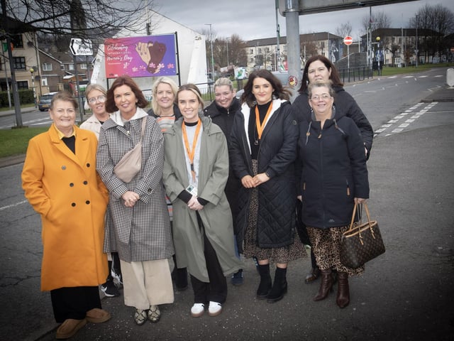 INTERNATIONAL WOMEN'S DAY. . . . .Group pictured at the Dove House Advocacy Project’s ‘International Women’s Day’ banner unveiling at Free Derry Corner on Tuesday. Front from left, Eileen Allen, chair, DHCT, Jayne Quigg, manager, DHCT, Brighdin Deane, Advocacy Project, DHCT, Margaret-Rose McAteer, Advocacy Project, DHCT, and Tina Kelly. Back from left, Paula Devine, Deirdre McDaid, Surestart (Edenballymore), Seanin Gillespie, and Maureen Collins, manager, Hive Support Group. (Photos: Jim McCafferty Photography)