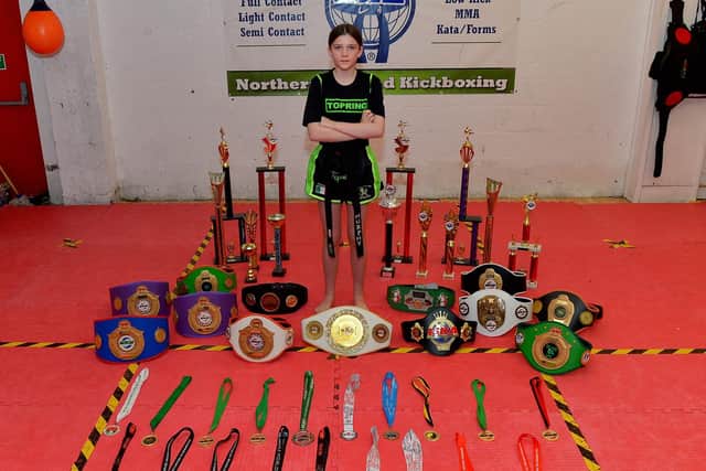 Champion kickboxer Annie Murphy, from the Top Ring Kickboxing Gym, picture with the belts, medals and trophies she has won. Photo: George Sweeney. DER2248GS – 46