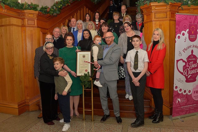 Lisa McGee, creator of Derry Girls, who was conferred with the Freedom of Derry City and Strabane by councillors yesterday evening pictured with family and friends in the Guildhall. Photo: George Sweeney. DER2249GS – 05