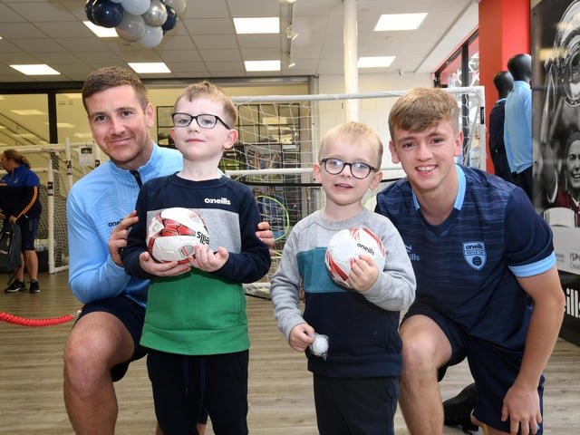 Derry City stars Patrick McEleney and Ciaron Harkin pictured with young fans who enjoyed meeting them at the O'Neills Superstore on Tuesday.