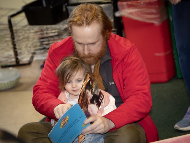 Dad Paul Farrell and daughter Charli (4) get in some reading practice during Open Day at Oakgrove Primary School. : .