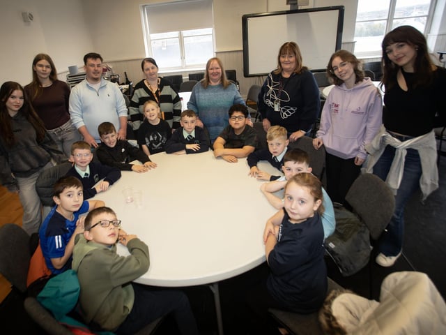 The Churches Trust staff and volunteers pictured with some of the pupils and staff from the Long Tower and Fountain Primary Schools during rehearsals for 'The Voyage of the Fellowship' on Friday last. : .