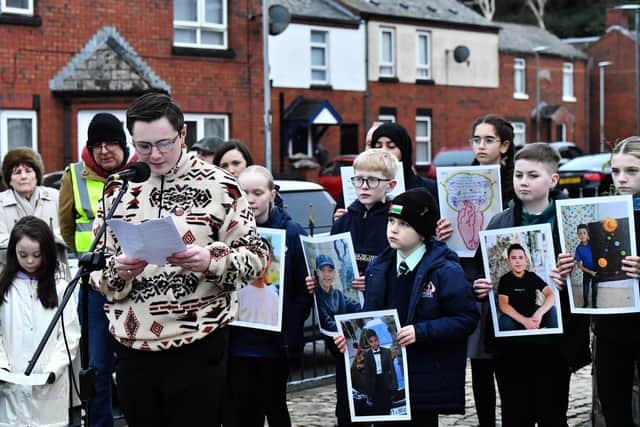Evan Curran, a relative of William Nash, reads a statement at the one minute silence dedicated to the children of Gaza at the Bloody Sunday monument on Thursday afternoon. Photo: George Sweeney