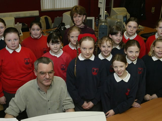 Children from Lisnagelvin Primary School pictured during a visit to the Journal offices with staff member John McDaid.