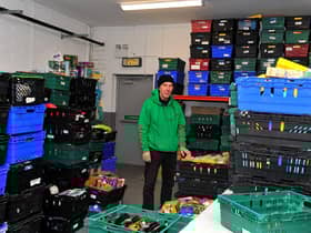 Paul Duffy works in the Foyle Foodbank distribution centre in Springtown Industrial Estate.  Photo: George Sweeney. DER2250GS – 26