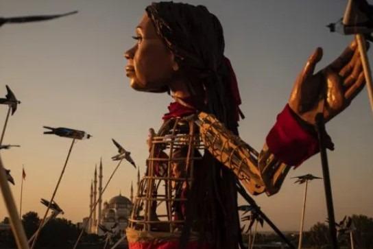 The 3.5 metres tall puppet - representing a young Syrian refugee girl – will visit a number of key landmarks in the city.
