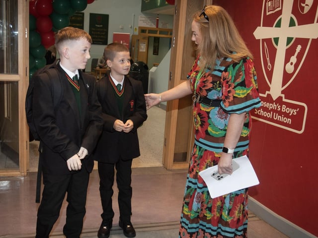 Year 8 students Aiden Doherty and Colum McGuinness getting their bearings on their first day from Mrs. Carla Hagan on Monday at St. Joseph's. : St. Joseph's Boys School welcomes latest influx of Year 8 pupils