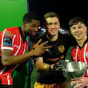 Derry City players Sadou Diallo, Brian Maher and Adam O’Reilly with the President’s Cup after their victory over Shamrock Rovers at the Brandywell on Friday evening. Photo: George Sweeney. DER2307GS – 87
