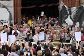 Relatives of those killed on Bloody Sunday emerged from the Guildhall holding the Saville report, June 15, 2010. (PressEye)
