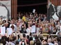 Relatives of those killed on Bloody Sunday emerged from the Guildhall holding the Saville report, June 15, 2010. (PressEye)