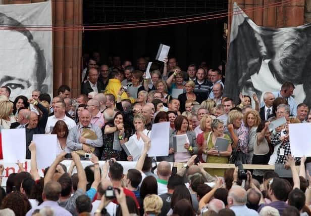 Relatives of those killed on Bloody Sunday emerged from the Guildhall holding the Saville report, June 15, 2010. (PressEye)