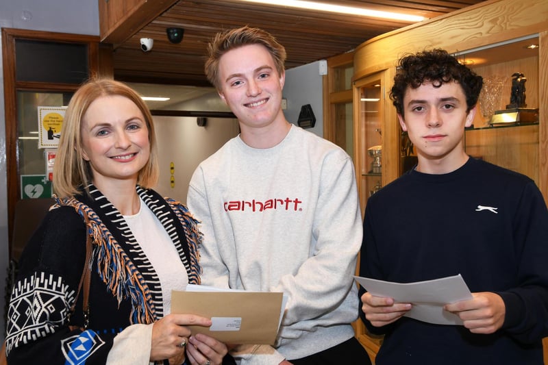 Proud mum Ciara Devlin pictured with her son Joey, centre, and his pal Donal Mooney when they picked up their GCSE results at St. Columb's College.